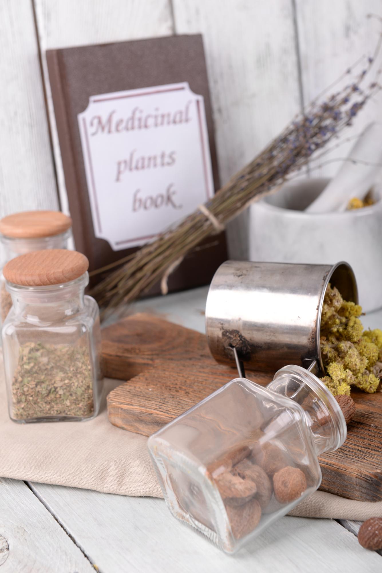 studio counter with jars of spices, labeled envelopes and a folded recipe