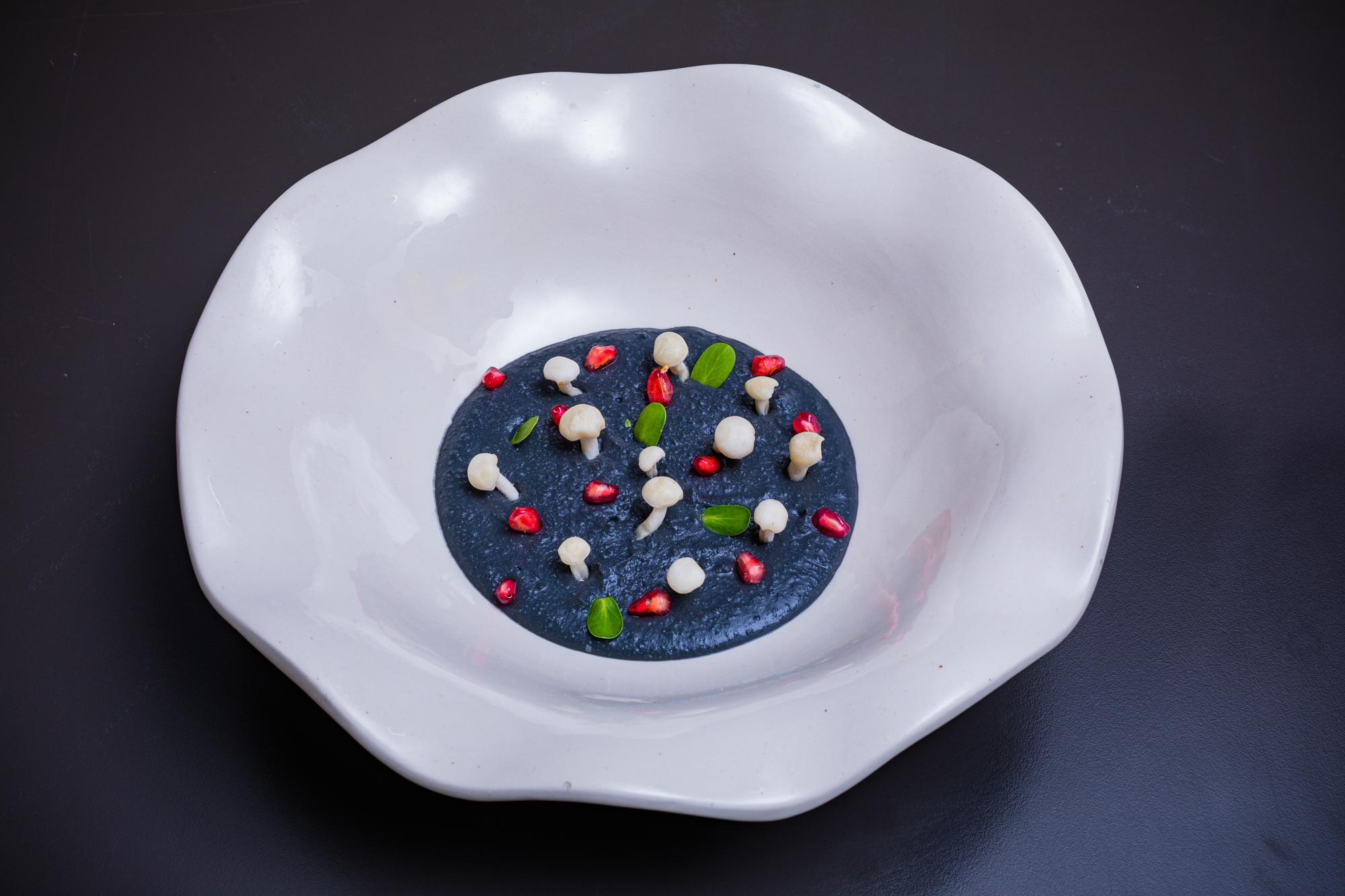 plated composed dish on ceramic plate with minimal garnish